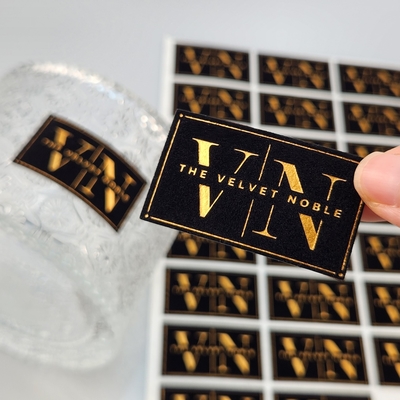 comprar High Quality Customized Embossed UV Gold Foil Printing Card Press Gold Art Paper Velvet Gold Stamping Label Sticker for Perfume & Party  online manufacture